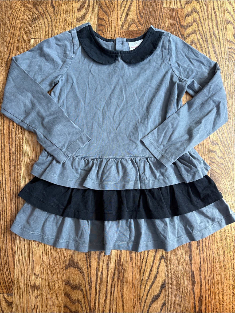 Hanna Andersson black and gray ruffle peplum tunic, size 130 (7-8). Like new